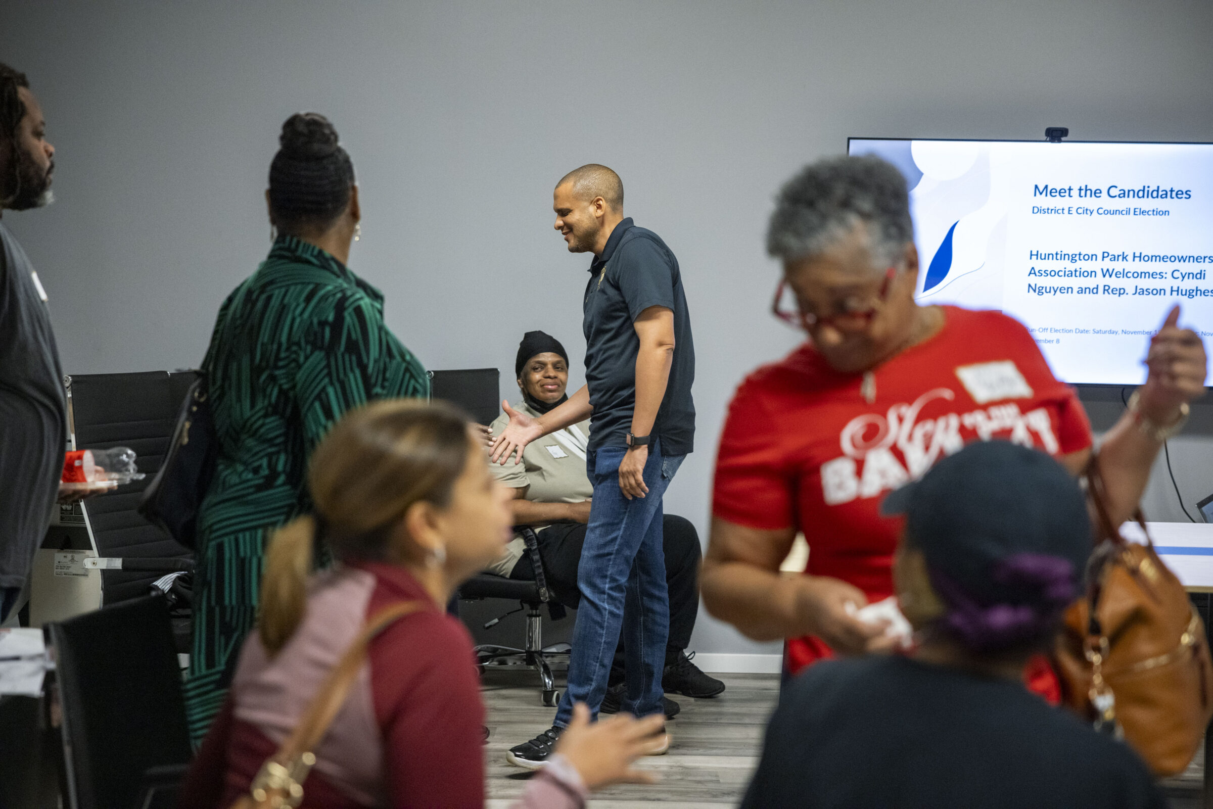 City Council candidate for District E John Hughes greets residents at a “Meet the Candidates” event in New Orleans East on October 25, 2025.