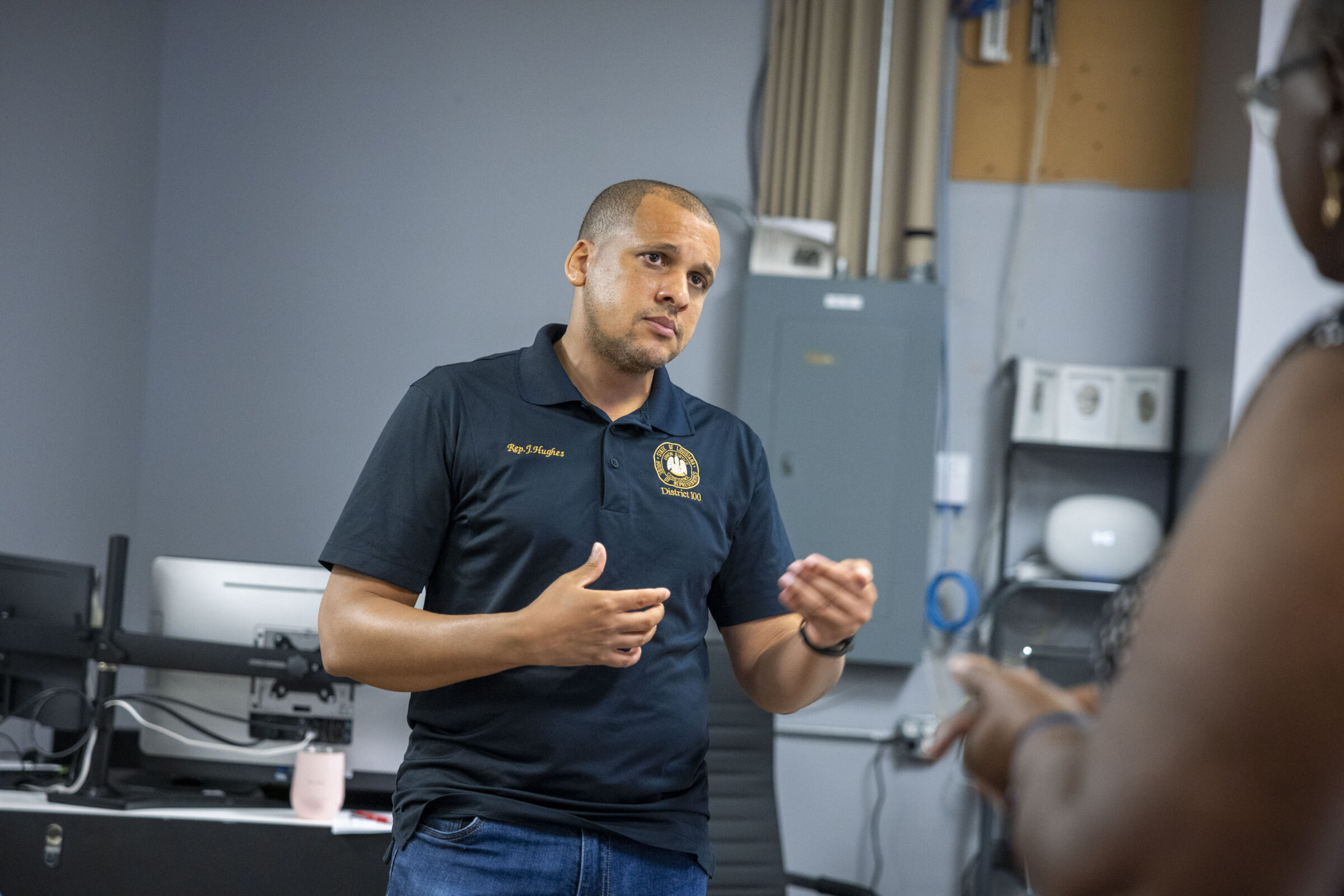 City Council candidate for District E John Hughes speaks with a resident during a “Meet the Candidates” event in New Orleans East on October 25, 2025.